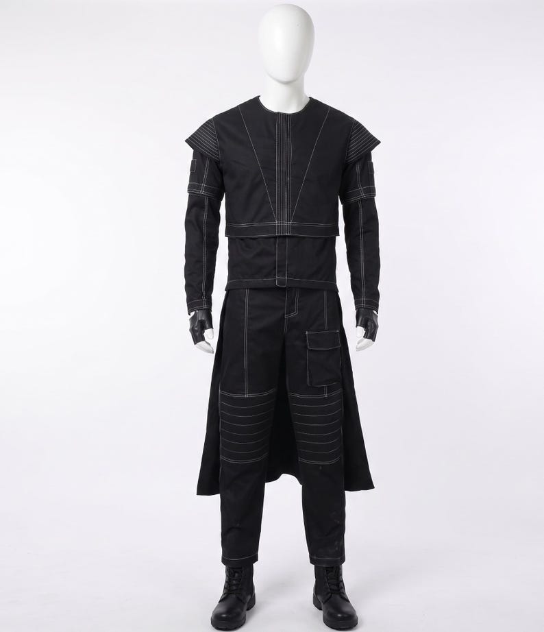May include: A black long-sleeved jacket and matching trousers set featuring prominent white contrast stitching. The jacket has structured shoulders and a layered front, while the trousers include a side cargo pocket, knee panel detailing, and a rear skirt overlay.