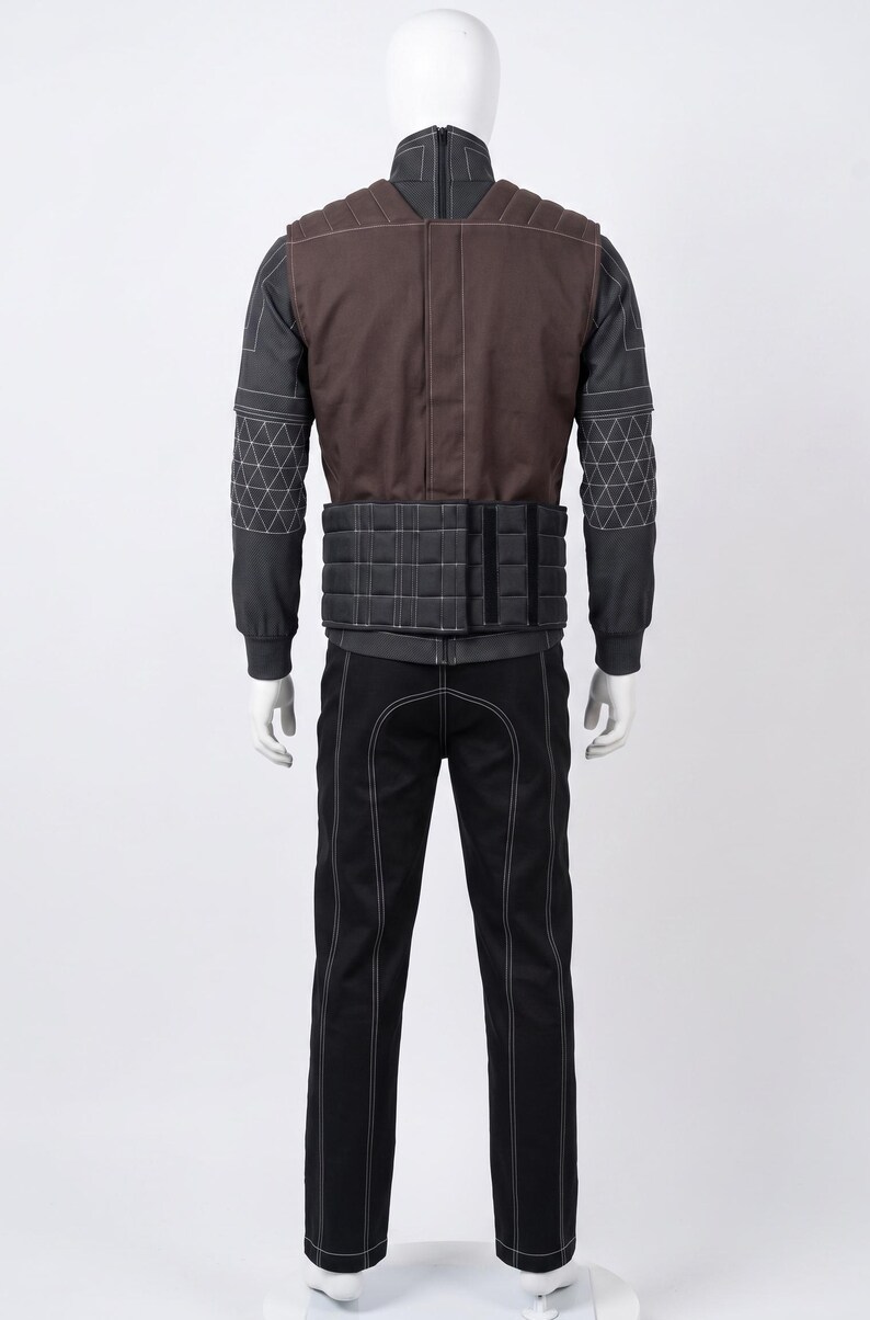 May include: A black and brown tactical outfit on a mannequin. The outfit features a brown vest with white stitching, a black jacket with geometric patterns on the sleeves, and black trousers with white stitching. The outfit is designed for protection and utility.