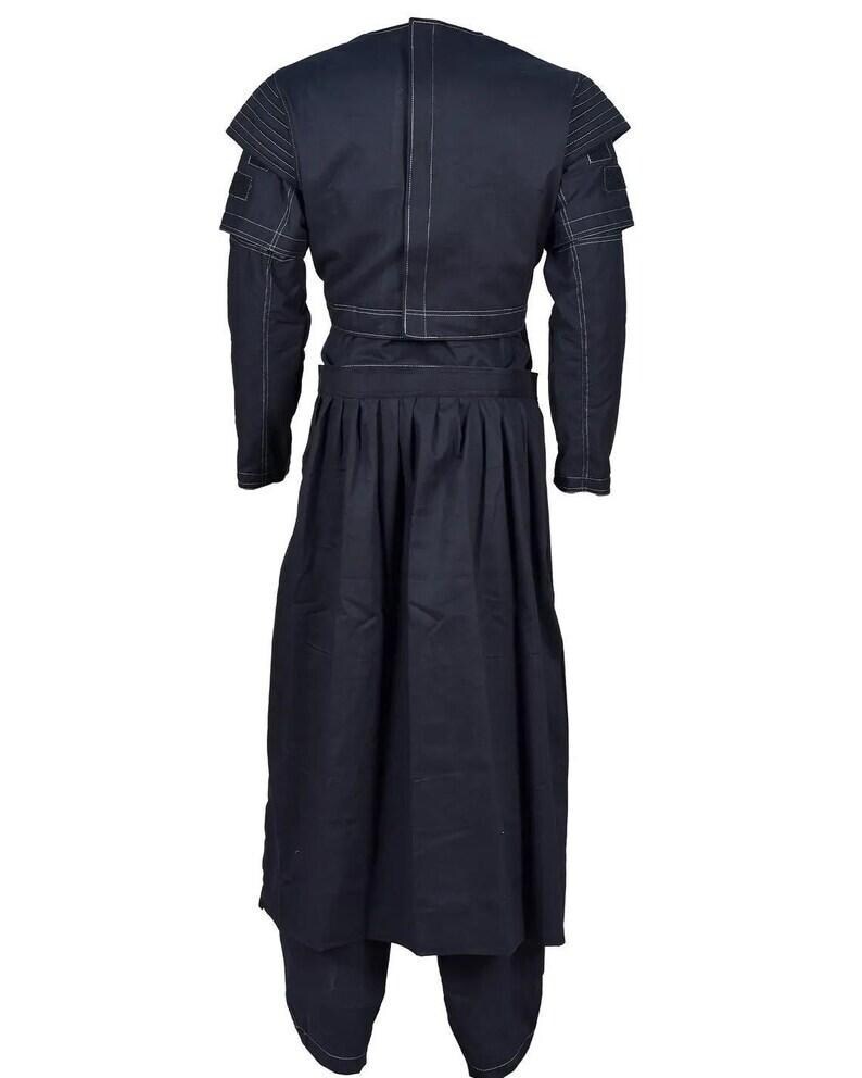 May include: A dark navy blue long-sleeved jacket and matching pleated skirt set. The jacket features structured shoulders with ribbed detailing, a vertical center seam, and white contrast stitching throughout the garment. The skirt is floor-length.