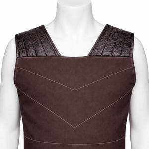 May include: A sleeveless dark brown vest featuring a smooth matte finish on the main body with white stitched chevron detailing. The shoulder panels are constructed from a textured black material with vertical quilted stitching patterns.