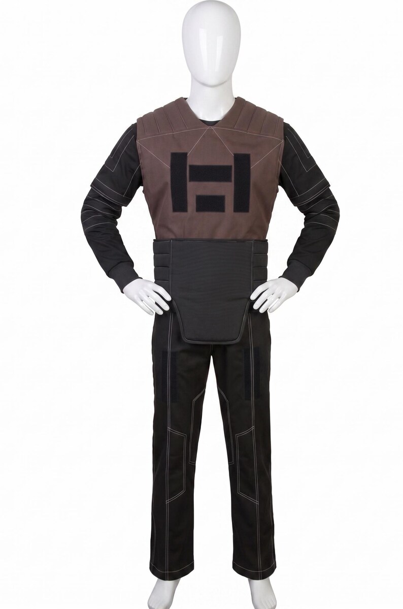 May include: A costume comprising a brown vest with a black rectangular design, a black belt, a black long-sleeved shirt, and black trousers with white stitching. The outfit is displayed on a mannequin.