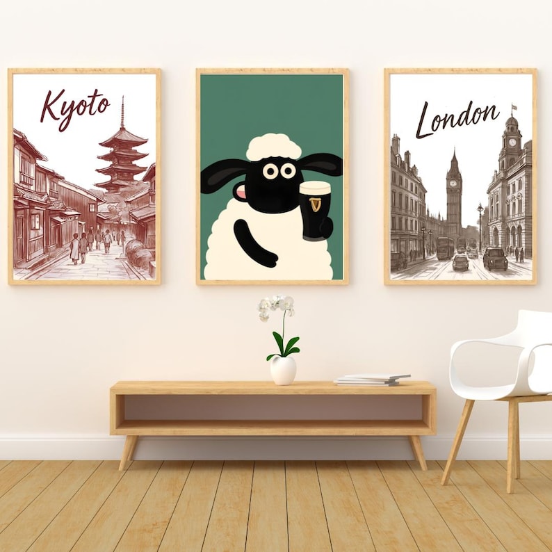 May include: Three framed art prints. The left print features a Kyoto scene with the word "Kyoto" in a script font. The center print shows a cartoon sheep holding a pint of Guinness. The right print depicts a London street scene with the word "London".