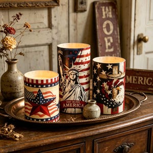 May include: A set of three ceramic mugs with a speckled, matte finish in cream, light grey, and dark grey. Each mug has a simple, minimalist design and a rounded handle.