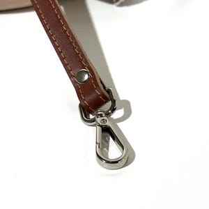 elegant leather bag strap, minimalist leather strap for bag, stitched leather shoulder strap, durable leather purse strap, genuine leather replacement strap, leather strap for diy bag, handbag strap with silver hardware, handbag strap with gold hardware