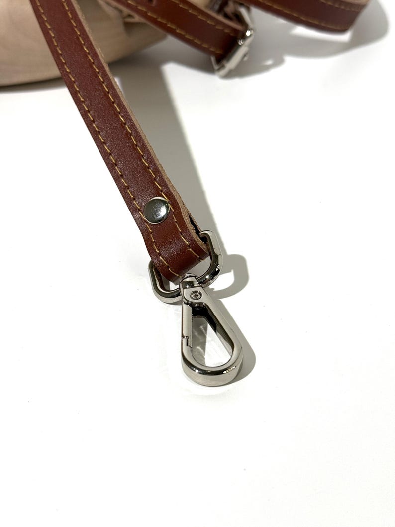 elegant leather bag strap, minimalist leather strap for bag, stitched leather shoulder strap, durable leather purse strap, genuine leather replacement strap, leather strap for diy bag, handbag strap with silver hardware, handbag strap with gold hardware