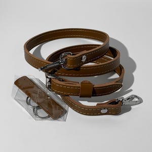 leather strap for women bag, classic leather shoulder strap, everyday leather bag strap, polished leather replacement strap, leather strap for custom purse, refined leather handbag accessory, slim purse strap adjustable