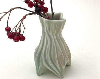 Small carved porcelain bud vase in yellow green, pink blush with curvy grooves