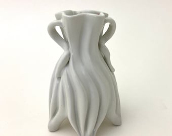 Small carved porcelain bud vase in yellow and lavender, with curvy grooves & handles