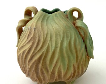 Matte green, gold, tan & brown carved porcelain vessel with handles