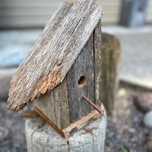 rustic birdhouse made from old an old wood fence