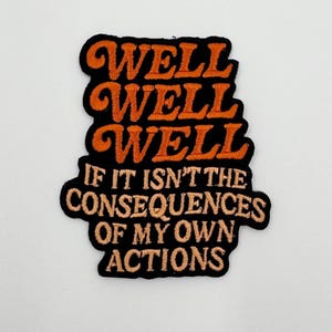 Puede incluir: Parche bordado con las palabras "WELL WELL WELL" en escritura naranja sobre la frase "IF IT ISN'T THE CONSEQUENCES OF MY OWN ACTIONS" en letras de bloque naranja, todo sobre un fondo negro.