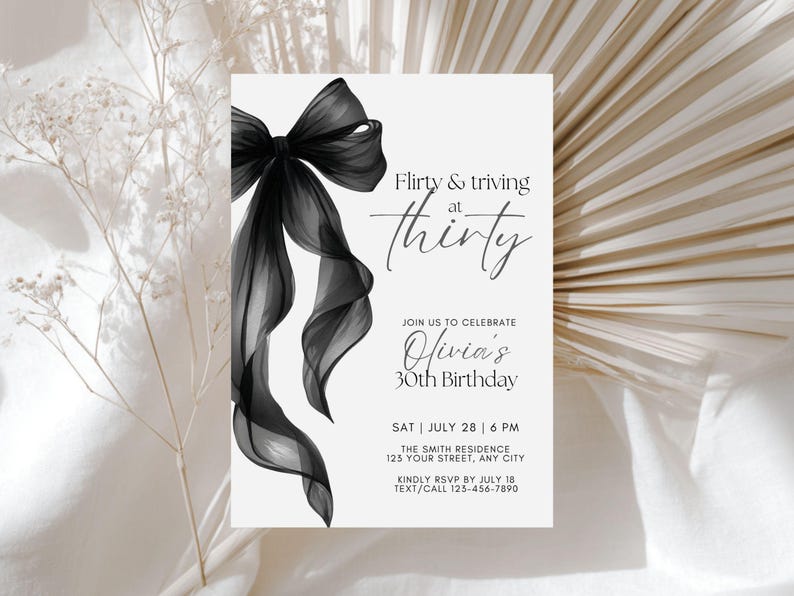 May include: A white invitation card with a black bow and the text "Flirty & thriving at thirty." The invitation is for Olivia's 30th birthday, with the date, time, and location details. The card also includes an RSVP request.