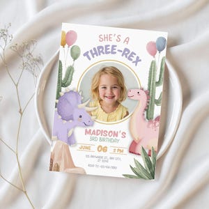 May include: A birthday invitation with the text "She's a Three-Rex" and a photo of a young girl. The invitation features illustrations of dinosaurs, cacti, and balloons. The date and time of the party are also included.
