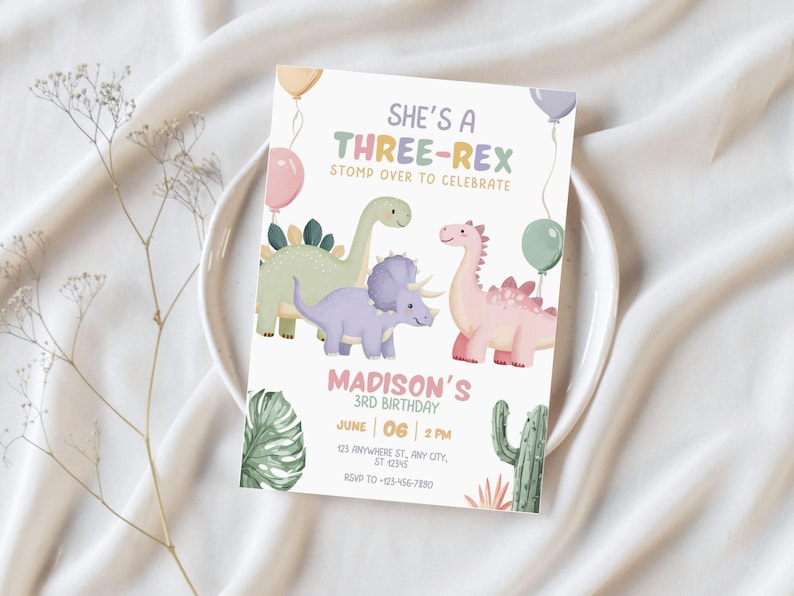 May include: A pastel-colored invitation card with the text "SHE'S A THREE-REX STOMP OVER TO CELEBRATE". The card features illustrations of three dinosaurs, balloons, and tropical plants. The text "MADISON'S 3RD BIRTHDAY" is also included, along with date, time, and address.