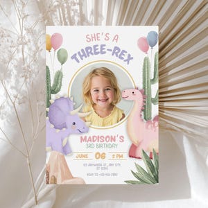 May include: A birthday invitation with a child's photo, featuring a dinosaur theme. The text reads "She's a Three-Rex" with a child's name and birthday details. Includes illustrations of dinosaurs, cacti, and balloons.