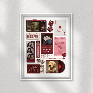 May include: A framed collage with various burgundy-colored elements. Includes photos, a vintage-style camera, dice, playing cards, and a vinyl record. Text includes "Anniversary 06-08-2020", "Perfect Match", and "Lucky us".