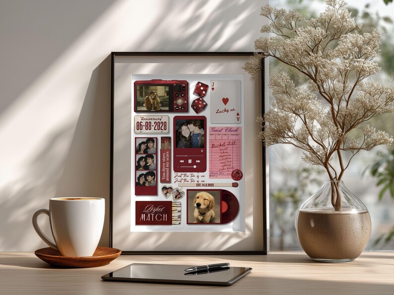 May include: A framed collage featuring photos, a red camera, dice, and a vinyl record. The collage includes the text "Anniversary 06-08-2020" and "Perfect Match". A cup of coffee and a tablet with a pen are on the table.