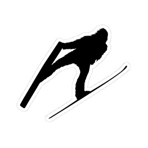 May include: Black silhouette sticker of Bigfoot skiing. The creature is depicted in mid-air, holding ski poles and gliding down a slope on skis. The sticker has a white border.