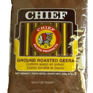 May include: A brown bag of Chief Brand ground roasted geera, also known as cumin. The packaging features a yellow and brown label with the brand name and a logo of a Native American chief. The net weight is 8.1 oz.