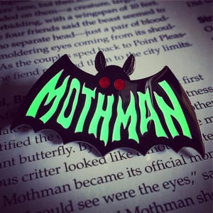 Mothman Symbol ENAMEL PIN - Glow in the Dark - Cryptozoology Tracking Society moth red glitter eyes typography text lettering sign