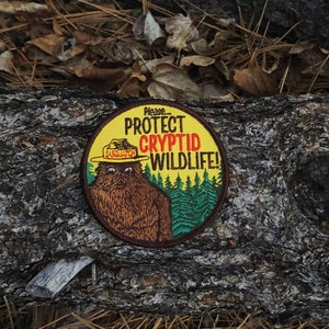 Cryptid PSA Patch Cryptozoology Tracking Society Bigfoot Sasquatch Badge NPS Smokey the Bear Woodland Hiking Camping Fish Hunt image 6