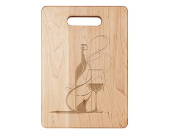 May include: A rectangular wooden cutting board with a handle, featuring an etched design of a wine bottle and a filled wine glass. The design includes flowing lines, suggesting the pouring of wine. The wood has a light, natural color.