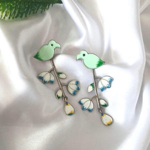 May include: A set of three ceramic mugs with a speckled, matte finish. The mugs are in shades of cream, light gray, and dark gray. Each mug has a simple, minimalist design, perfect for coffee or tea.