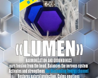 May include: A hexagonal pendant with a deep blue and purple design, suspended from a black cord. The pendant is labeled "LUMEN" and is made in Ukraine. The image also includes text about the pendant's properties.