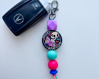 Spooky Book Club Keychain: Skeleton Charm, E-Reader Accessory