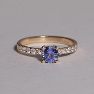 Blue-Violet Cubic Zirconia Engagement Ring: Diamond Accented Gold Band