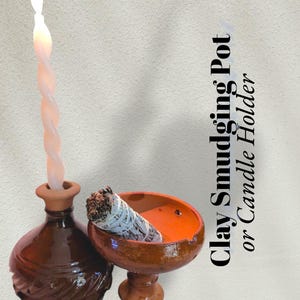 May include: A brown clay candle holder with a lit, twisted candle and a matching clay smudge pot with a bundle of sage. The text on the image reads "Clay Smudging Pot or Candle Holder."