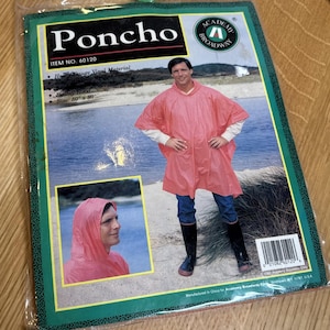May include: A pink vinyl poncho in a package. The package has the word "Poncho" in large white letters. The poncho is 50" x 80" and has a roomy hood. The package also has a picture of a person wearing the poncho.