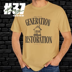 May include: Mustard yellow t-shirt with the text "THERE WILL BE GENERATION RESTORATION" in black, along with a house graphic. The shirt also has the text "MALACHI 4:6". The shirt is a short-sleeved crew neck.