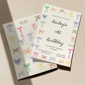 May include: Two cream-coloured birthday invitations with colourful bow illustrations. One invitation is open, displaying the text "Bailey's 10th Birthday" and event details. The other invitation is closed, with bow illustrations.
