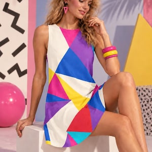 Färgglad geometrisk A-linjeformad klänning med fickor, retro 60-talsmodig ärmlös stil bild 1