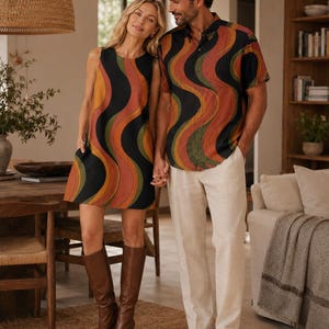 Woman wearing a retro wave A-line mini dress beside a man wearing the matching short-sleeve shirt from the same retro collection.
