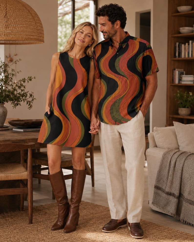 Woman wearing a retro wave A-line mini dress beside a man wearing the matching short-sleeve shirt from the same retro collection.