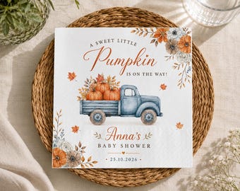 May include: A square paper napkin featuring a watercolor illustration of a blue vintage truck carrying pumpkins. The text reads A SWEET LITTLE Pumpkin IS ON THE WAY! Anna's BABY SHOWER 25.10.2026, surrounded by orange and white floral autumn foliage.