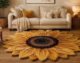 May include: A round, tufted area rug shaped like a sunflower with a dark brown center and layered, textured yellow petals. The rug features the text carpet delight store printed in a subtle font across the surface of the petals.