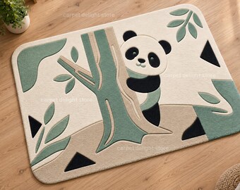 May include: A rectangular area rug featuring a cream-colored background with a central green tree trunk and a panda bear peeking from behind it. The design includes sage green leaf accents and small black triangles scattered across the surface.