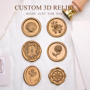 May include: Gold-coloured wax seals with embossed designs, including a seashell, flowers, and a four-leaf clover. The text "CUSTOM 3D RELIEF MADE JUST FOR YOU" is displayed. A wooden handled seal stamp is visible.