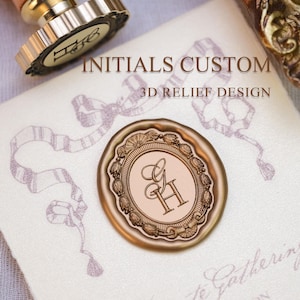 May include: A custom wax seal featuring the initials "GH" within an ornate oval frame. The seal is a warm, golden-brown hue, with the text "INITIALS CUSTOM 3D RELIEF DESIGN" above. It rests on a cream-coloured surface.