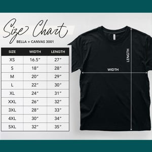 May include: Black t-shirt with a size chart, including measurements in inches, for Bella + Canvas 3001 shirts. The chart lists sizes XS to 5XL, with widths from 16.5" to 32" and lengths from 27" to 35".