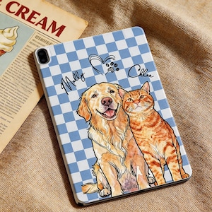 May include: A tablet case featuring a golden retriever and a tabby cat illustration. The case has a blue and white checkered pattern background. The names "Molly" and "Chloe" are written on the case, along with a heart and paw print design.
