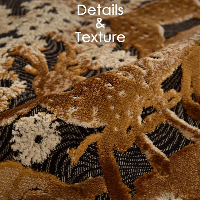 May include: Close-up of a textured fabric with a detailed pattern. The design features a repeating motif of deer in shades of brown and cream against a black and grey background. The text "Details & Texture" is visible.