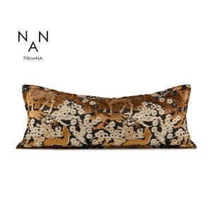 May include: Long rectangular cushion featuring a deer and floral design in brown and gold tones. The pattern is set against a black background with white floral details. The brand name "PillowNA" is printed in black.