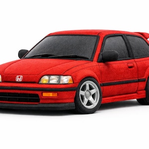 Könnte beinhalten: Ein rotes Schrägheckauto mit schwarzen Zierleisten und schwarzen Seitenspiegeln. Das Auto hat silberne Räder und einen Heckspoiler. Das Honda-Logo ist auf der Vorderseite des Autos sichtbar. Es ist ein Modell.