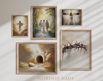 May include: A collection of framed religious art prints. The images depict scenes such as the resurrection, the crucifixion, and figures walking on a path. The frames are a light wood color, and the art has a soft, painterly style.