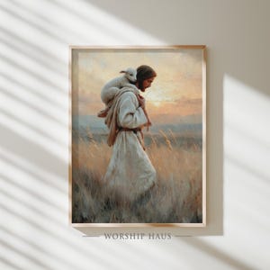 May include: A framed print depicts a figure in a white robe carrying a lamb on their shoulders, set against a backdrop of a sunset over a field of tall grass. The text "WORSHIP HAUS" is at the bottom.