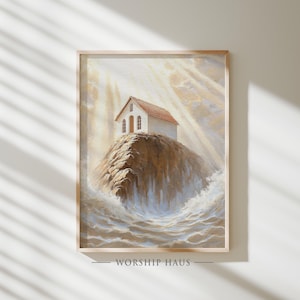 Puede incluir: Una impresión artística enmarcada representa un pequeño edificio blanco con tejado rojo sobre un acantilado rocoso, rodeado de un mar turbulento. La obra está bañada en luz cálida, con el texto "WORSHIP HAUS" en la parte inferior.